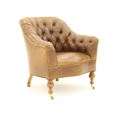 This tufted armchair features a unique design crafted with premium tan leather for maximum comfort and durability. It's tufted back and plush cushioning offers a luxurious look and feel that will add style to any room.