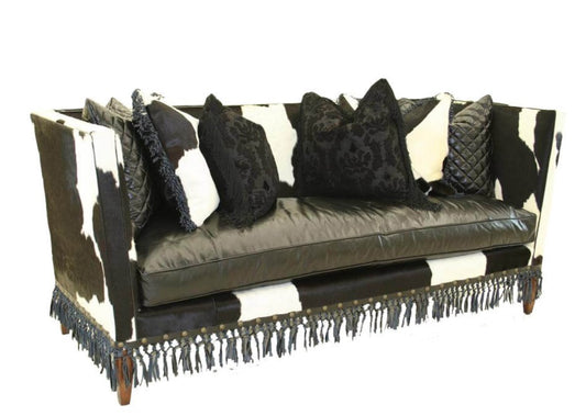 This French Country Fringe Trim Sofa offers a timeless, sophisticated look that will bring any living room to life. Crafted from a mix of leather and upholstered material or hide, this sofa provides unparalleled comfort and durability. Its French Country design brings visual interest while its fringe trim adds dimension, ensuring that this distinctive piece will be a beautiful centerpiece in any home.
