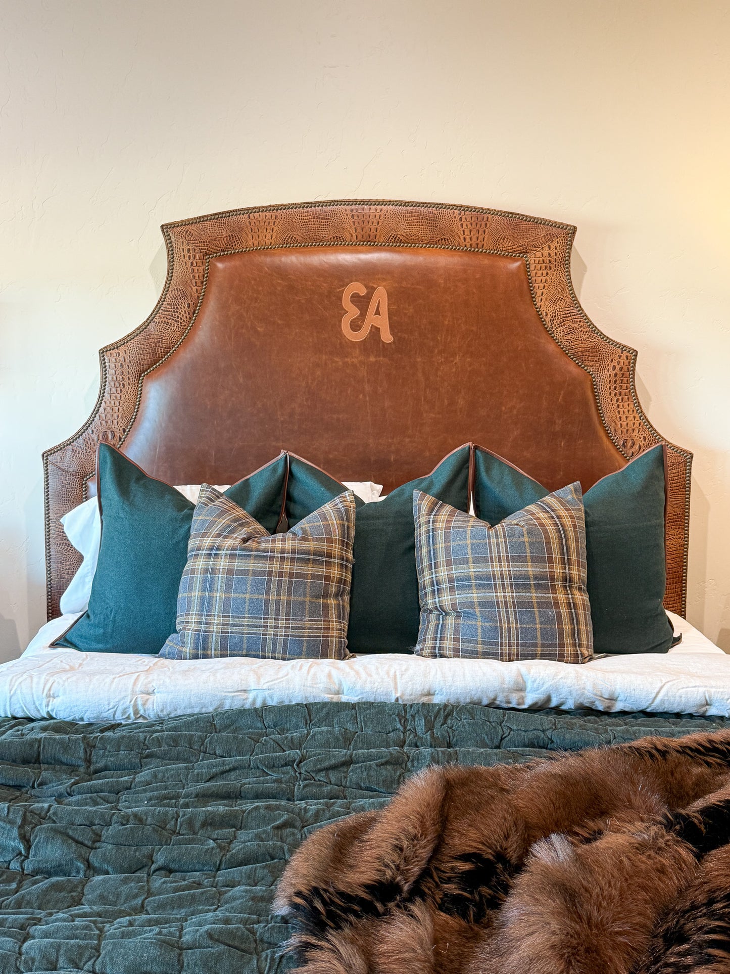 brown leather bed with alligator accents