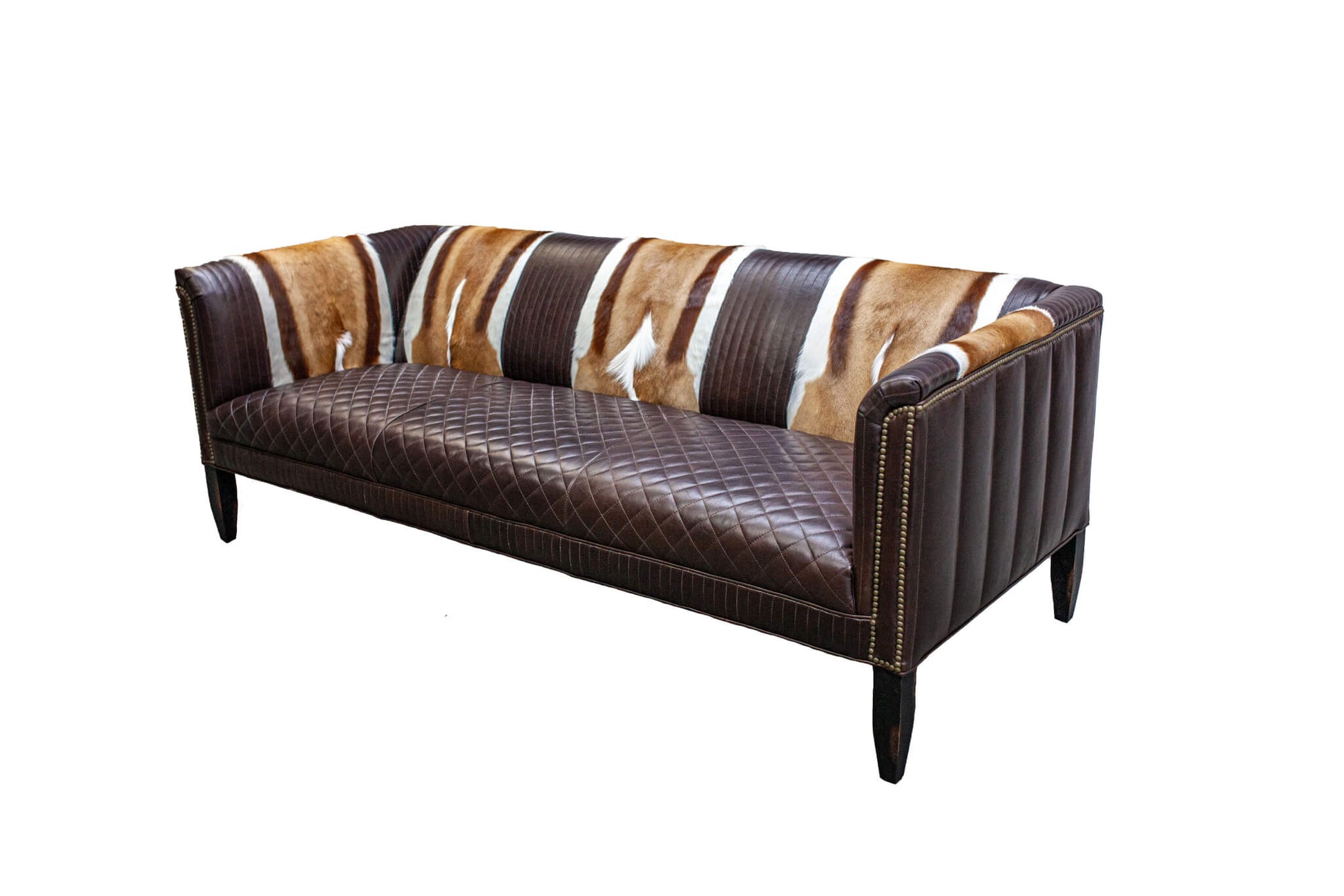 Bring modern luxury to your home with this stylish quilted nailhead sofa. Crafted from durable materials, this sofa is sure to last for years. Featuring a quilted finish and modern nailhead accents, this sofa will provide a sophisticated feel to any room.