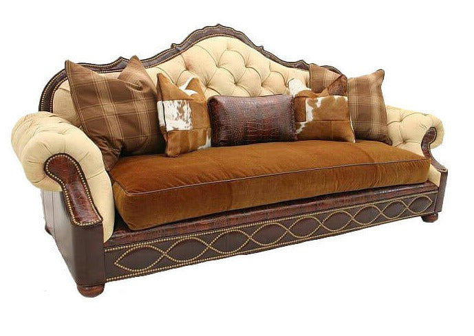 This Victorian-Modern hybrid sofa offers a timeless design featuring a tufted seat, back, and arms, with decorative nailhead accents, upholstered with both leather and fabric. Perfect for any living area, its durability and style will last for years to come.