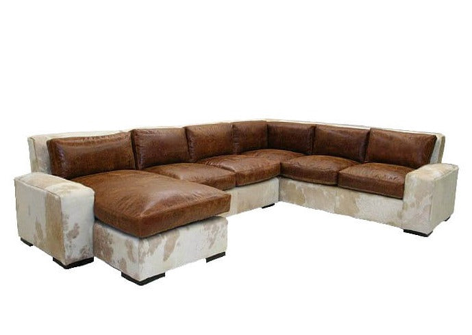 This Leather and Hide Sectional Sofa adds modern and luxurious appeal to your living space with its clean lines, sumptuous leather and hide upholstery, and strong, durable frame. Crafted for long-lasting elegance, the sectional sofa is perfect for entertaining family and friends.