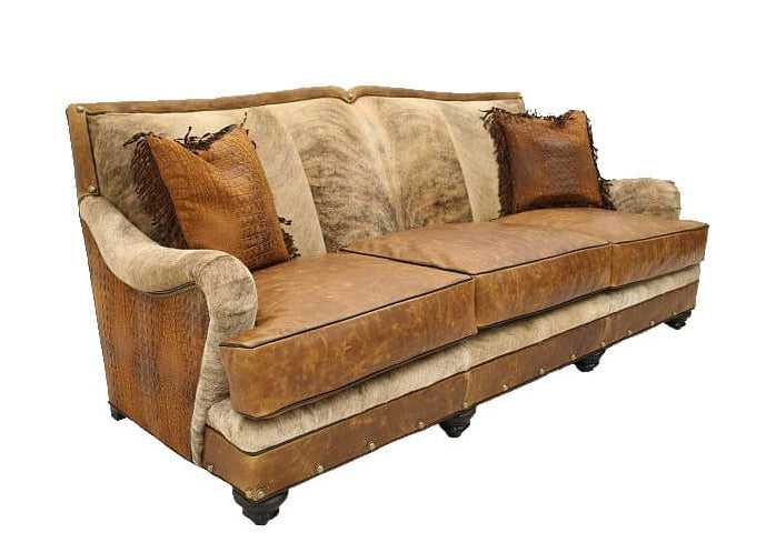 This elegantly designed Roll Arm Nailhead Hide Sofa is the perfect addition to any living room. Featuring a traditional roll arm and nailhead detailing, this piece brings a touch of classic style to any space. The luxurious hide fabric creates a timeless look that will last for years to come.