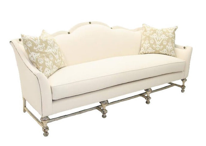 The French Country Sofa brings classic style to the living room. Featured in fabric upholstery or leather, plus stylish nailhead trim, it provides a luxurious, timeless look. Create a homey atmosphere and add a touch of elegance to your space.