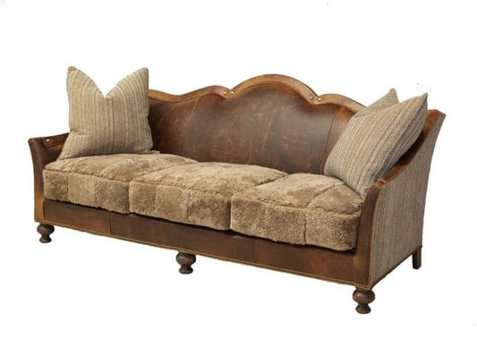 The French Country Leather and Chenille Sofa is the perfect living room statement piece. Combining the durability of leather with the softness of chenille, it offers modern luxury and comfort. Upholstered in the classic French Country style, this sofa is sure to make a memorable impression.