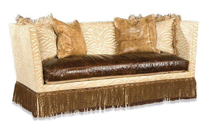 This French Country Fringe Trim Sofa offers a timeless, sophisticated look that will bring any living room to life. Crafted from a mix of leather and upholstered material or hide, this sofa provides unparalleled comfort and durability. Its French Country design brings visual interest while its fringe trim adds dimension, ensuring that this distinctive piece will be a beautiful centerpiece in any home.