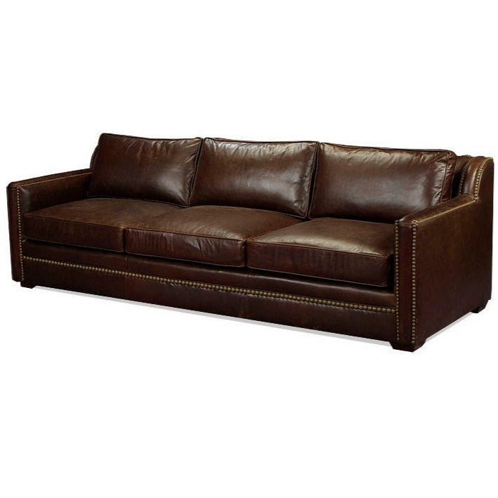 Our Classic Modern leather sofa adds sophistication to any living space with its timeless design and stunning nailhead trim detail. Its premium leather upholstery provides long-lasting comfort and unbeatable style. This is the perfect addition to any modern home.