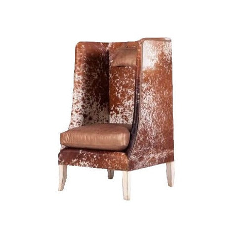 This High Back Hide and Leather Accent Chair is the perfect addition to your living room. Crafted with a high back and pure leather, this chair provides ultimate comfort and support. The stylish and modern design will be a stunning centerpiece in any room.