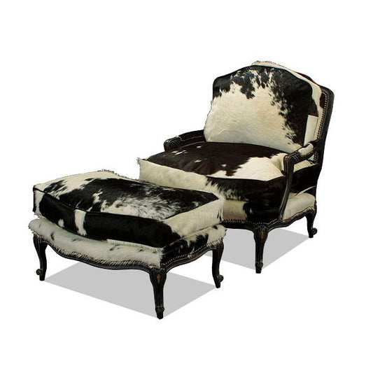 The Cowhide Chair & Ottoman is an exquisite combination of western and modern design, perfect for making a statement in any room. Upholstered with luxurious cowhide, this chair offers comfort and style with a wide seat that boasts a striking black and white color palette. Make a luxurious statement in your home with this striking piece.