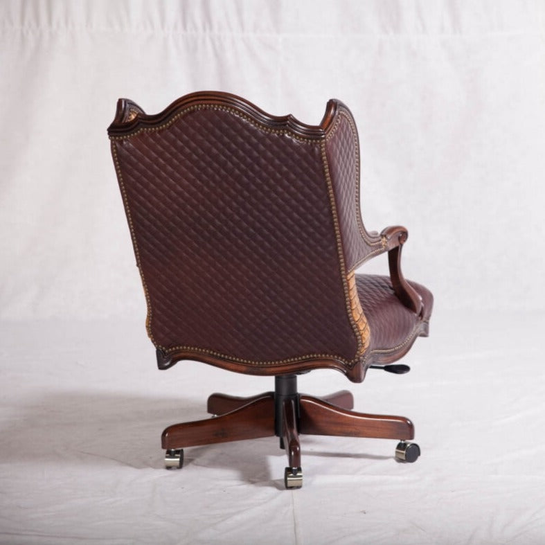 This Wingback Leather Office Chair is an elegant addition to any workspace, boasting an eye-catching crocodile skin leather upholstery and a regal, wingback design. The chair is anchored on a wooden base, providing a blend of classic western comfort and modern luxury.